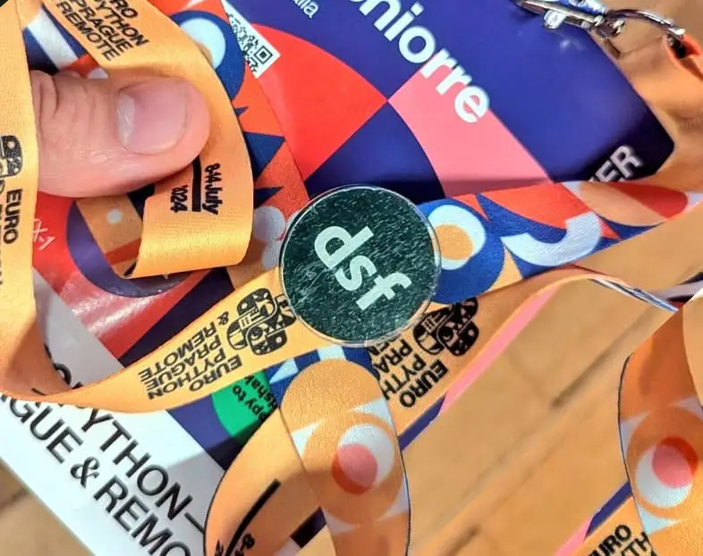 Close-up of a EuroPython Lanyard with a DSF pin on top